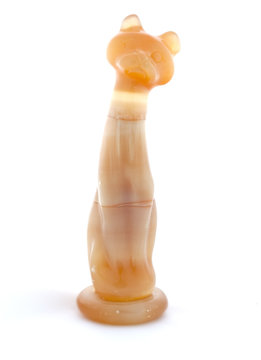 Figurine cat of selenite on white background