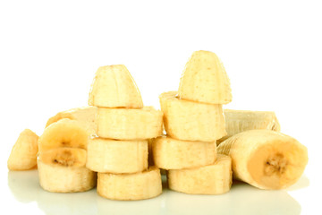 Chopped and peeled banana on white isolated background