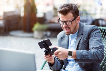 Cheerful man playing video games