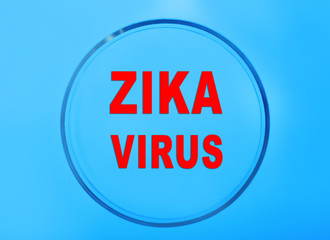 Zika virus danger concept. Petri dish with text zika virus on blue background.