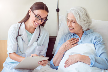 Young doctor with patient