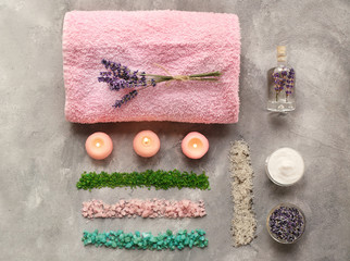 Obraz na płótnie Canvas Spa composition with lavender, towel and salt on gray background