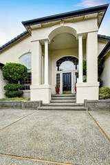 Fototapeta na wymiar Luxury house entry way exterior with concrete floor porch.
