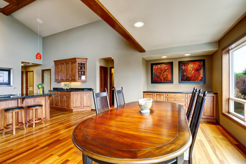 Open plan dining area with table set connected to kitchen