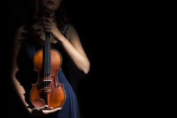 Violinist holding in your hands the violin.