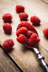 Raspberry on the rustic wooden table