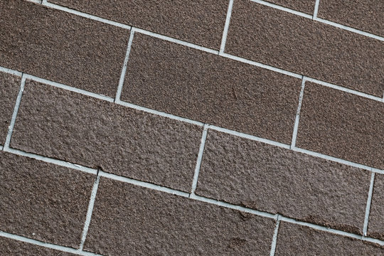 Brown brick wall closeup abstract background