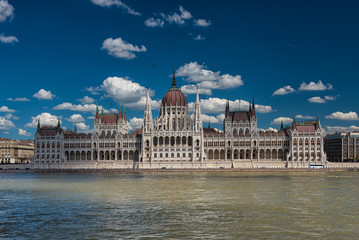 Fototapeta premium The famous Hungarian Parliament in Hungary with blue sky and clouds