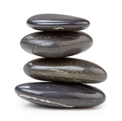 black pebbles stacked, isolated on white background