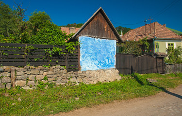 Fototapeta na wymiar Traditional old wooden carved gate in Atyha, Transylvania, Romania