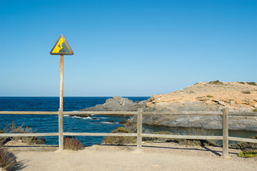 Rusty Danger Cliff Sign in Cabo de Palos - La Manga, Cartagena and San Javier, Murcia, Spain, Europe