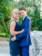 Couple hugging on a stone bridge