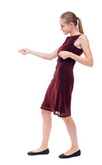 back view of standing girl pulling a rope from the top or cling to something. girl  watching. Rear view people collection.  backside view of person.  Isolated over white background. A girl in a