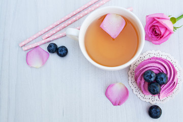 tea and pink marshmallows with blueberries