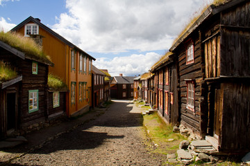 Street with traditional wooden houses in the historic Norwegian mining town Røros.
