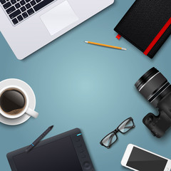 Office desk table with laptop, photo camera, glasses, graphic tablet, pencil, notebook, phone and coffee cup. Top view with copy space. Eps10 vector template.