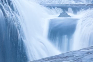 Foto auf Acrylglas Fast and flowing waterfall  background , long exposure © torsakarin