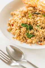 Fried basil leaf with pork and streamed rice..