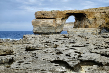 Dwejra bay, with its limestone arch and rock formations, on the Maltese island of Gozo. 