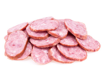 Slices of salami sausages isolated on a white background.