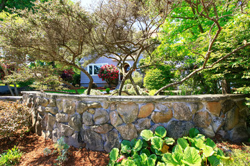 American craftsman house exterior. Nice landscape design around.