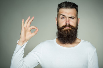 Bearded man with okey gesture