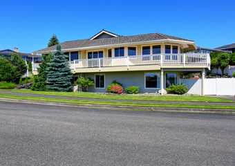 Luxury two level house exterior with large balcony