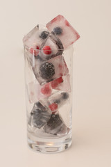 Ice Cubes with frozen Berries
