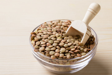lentils in glass bowl with scoop