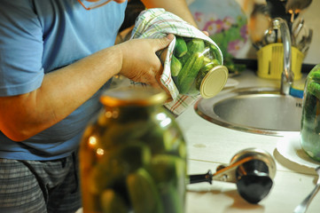 People are preparing in the kitchen. pickling cucumbers, preparation for winter salting.
