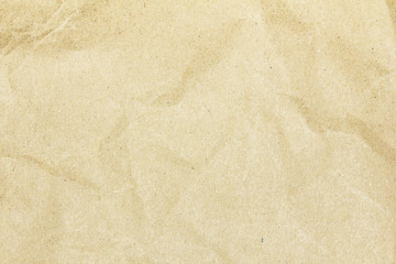 Recycled crumpled brown paper texture or paper background for design with copy space for text or image.