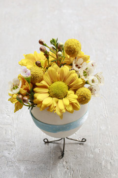 Bouquet of flowers in goose egg shell, easter table