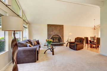 Spacious living room interior with brick fireplace