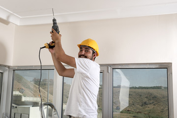 Happy Worker with Drilling Machine 