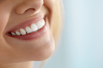 Closeup Of Beautiful Smile With White Teeth. Woman Mouth Smiling. High Resolution Image