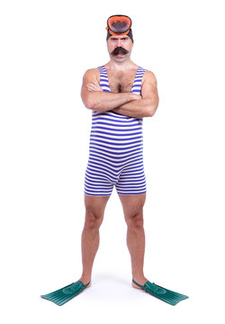 Man in swim dress standing with crossed hands