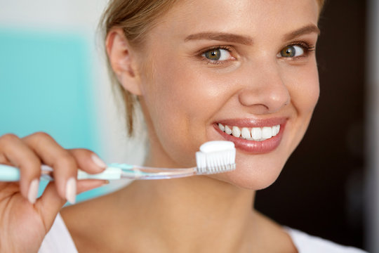 Woman With Beautiful Smile, Healthy White Teeth With Toothbrush. High Resolution Image