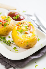 Potatoes stuffed with bacon, greens and eggs