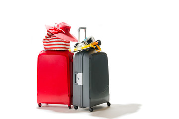 Suitcases with summer beach items
