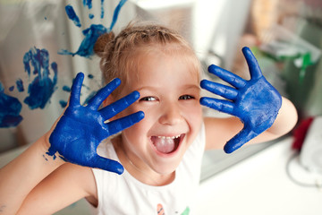 girl hands smeared with paint