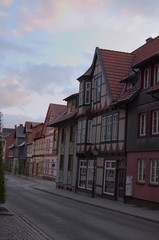 Fototapeta na wymiar Wernigerode, Germany - April 25, 2016: Old street in the early morning in Wernigerode in the district of Harz, Saxony-Anhalt, Germany