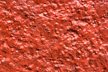 Red wall with decorative plaster