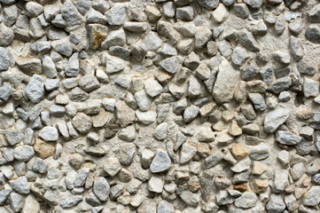 White house wall made of concrete panels consisting of small stones