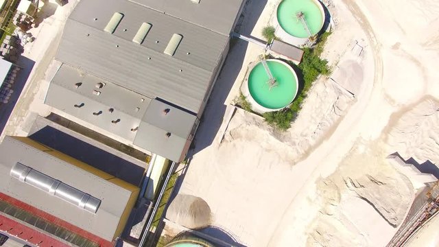 Camera flight over industrial zone, kaolin quarry and ceramics factory near Pilsen. Construction industry in Czech Republic, Europe. 