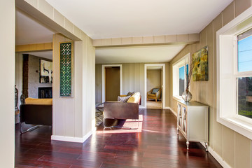 Hallway interior with wooden pannel trim and hardwood floor