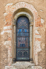 Fototapeta na wymiar Window of the old Catholic church