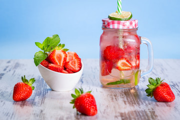 Summer strawberry lemonade in a jar glass