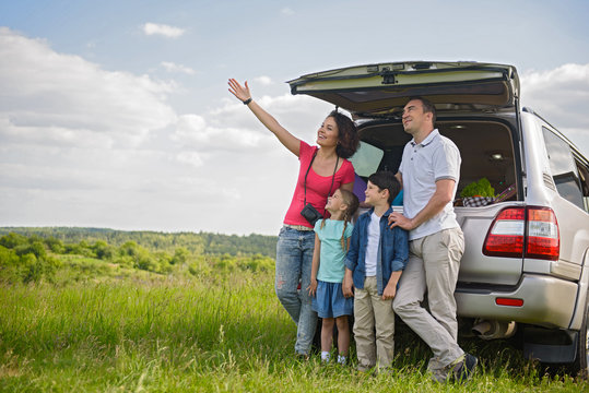 Happy Family Enjoying Road Trip And Summer Vacation