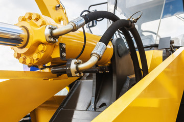 Fototapeta hydraulics tractor yellow obraz