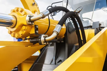 Fotobehang hydraulics tractor yellow © OlegDoroshin